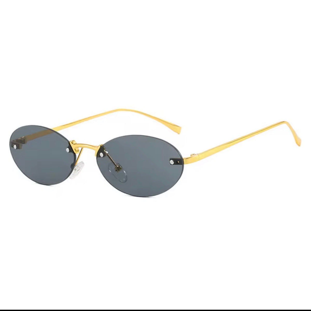 Rimless oval sunglasses with gold metal arms